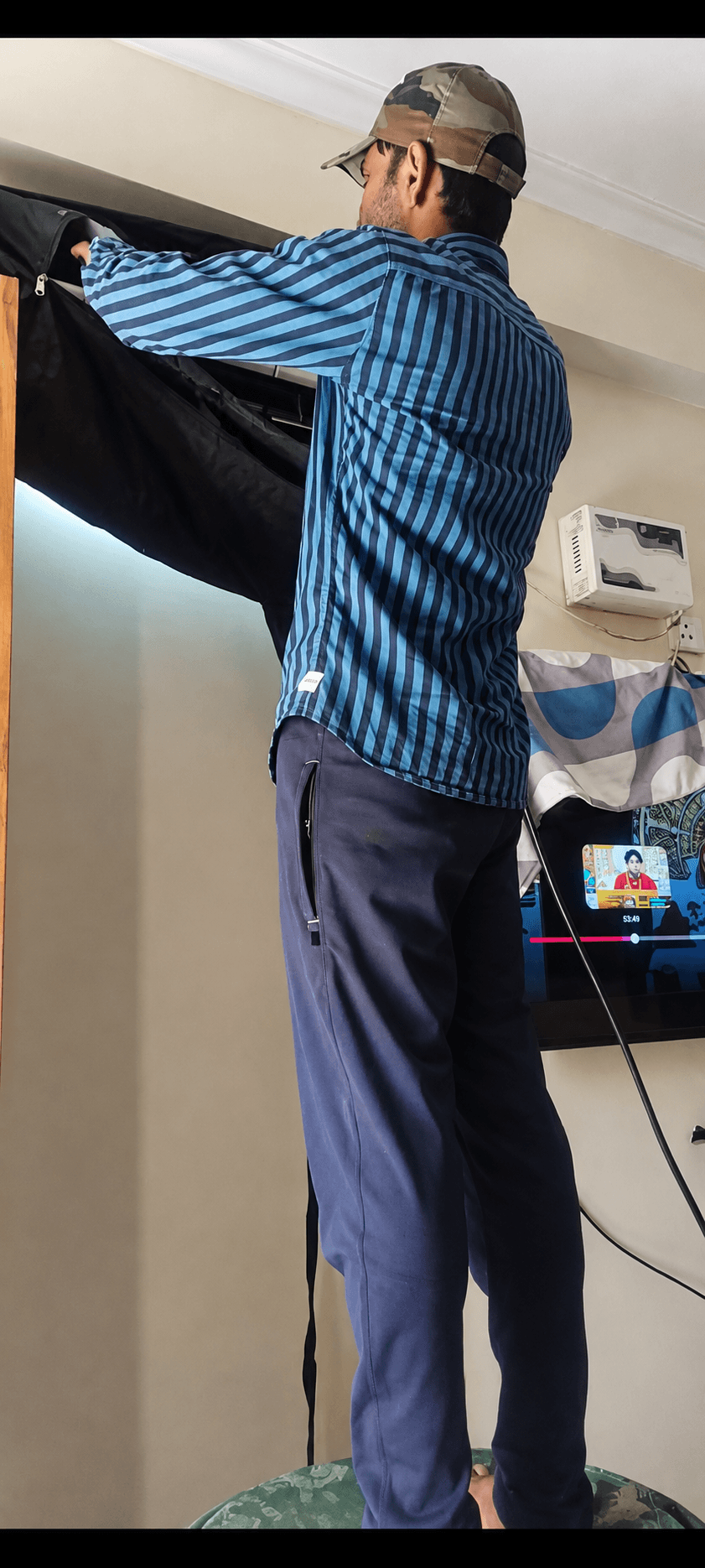 Cool Trust AC Solution technician working on an indoor AC with a protective cleaning cover in place